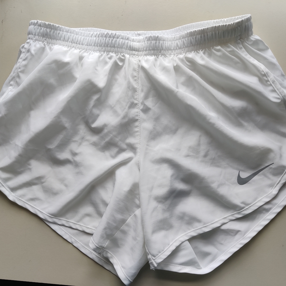 white Nike running shorts